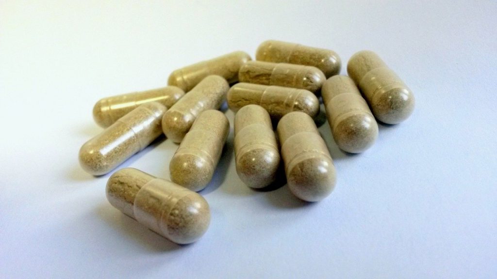 A closeup image of herbal capsules.